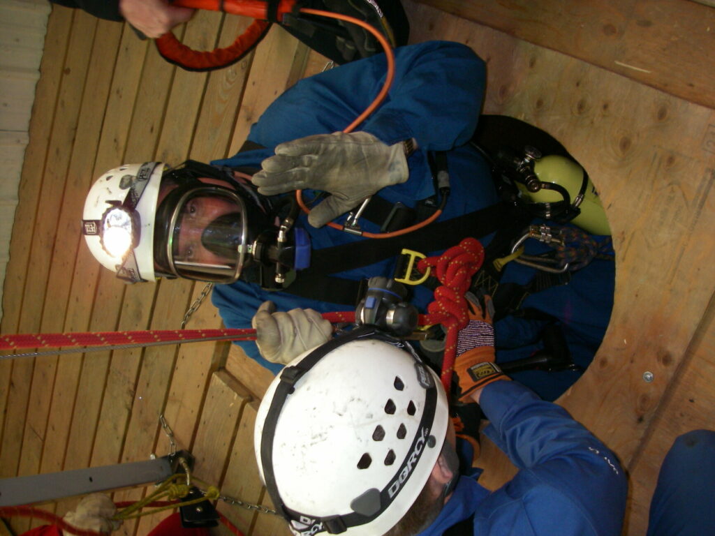 fire fighter in hole in ground