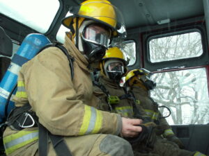 firefighters in firetruck