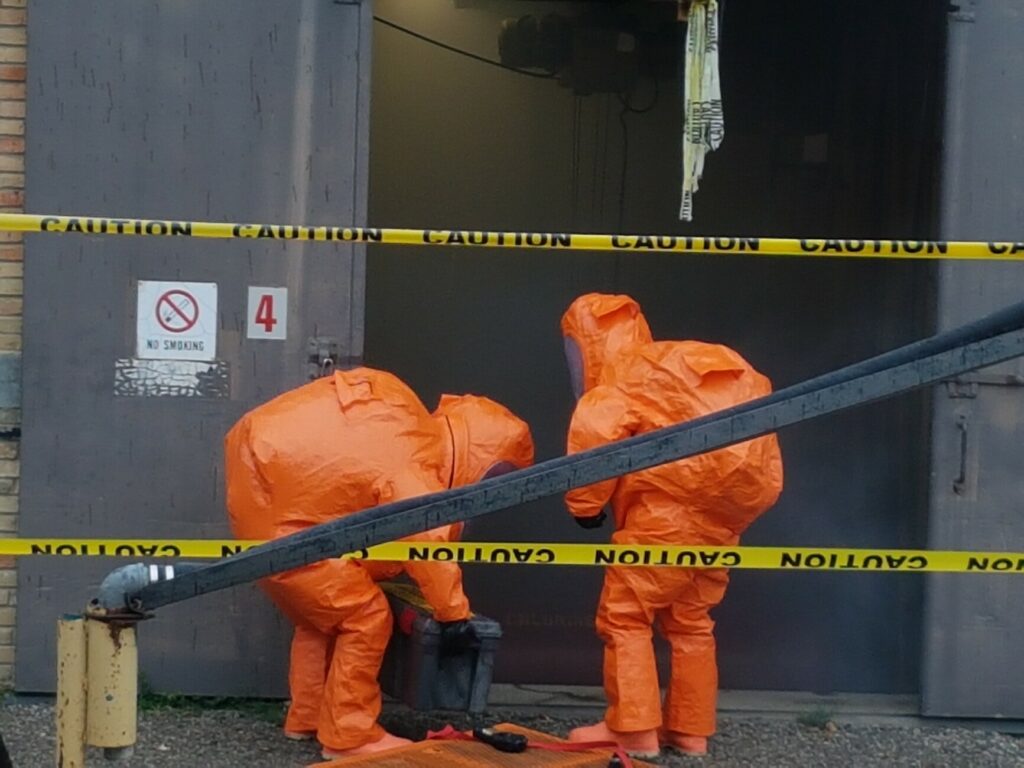 firefighters in chem suits