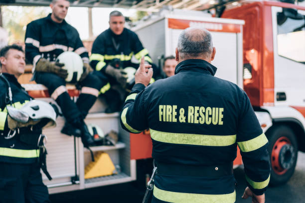 Firefighter boss giving team instructions
