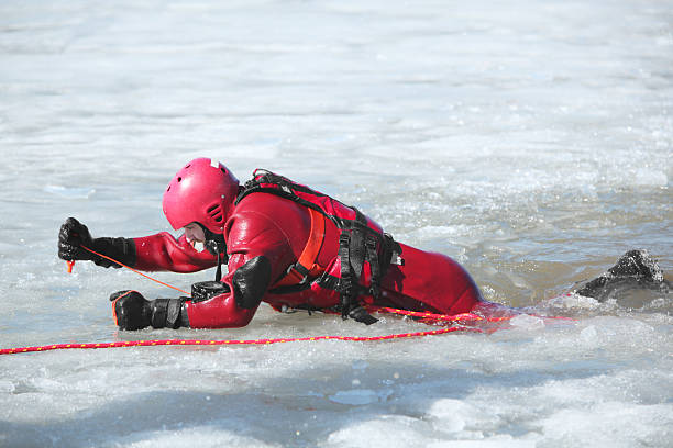 Ice water rescuer in water with ice.