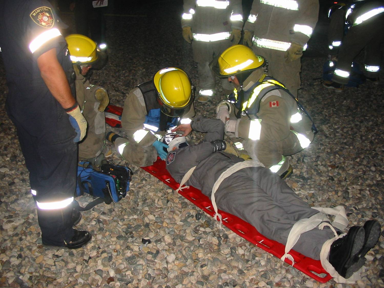 firefighters around man