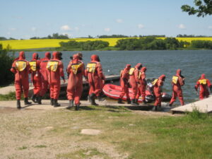 firefighters getting in watercraft